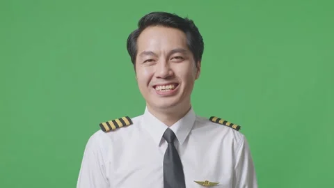 Man Pilot Standing And Smiling To Camera In The Green Screen Background Studio Stock Footage 244395519