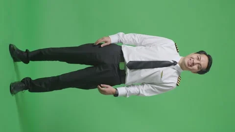 Man Pilot Standing And Smiling To Camera In The Green Screen Background Studio Stock Footage 244398801