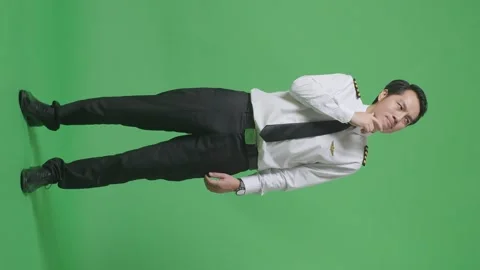 Man Pilot Thinking About Something And Looking Around  Standing On Green Screen Stock Footage 244398893