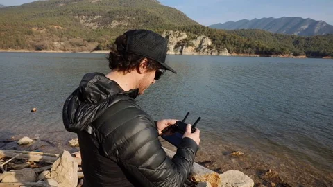 Man piloting a drone Stock Footage 102851689