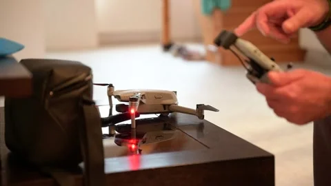 The man is piloting a drone Video stock 303716746