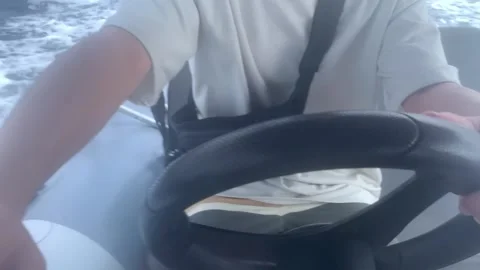 Man Piloting the Rubber Boat Stock Footage 253707635