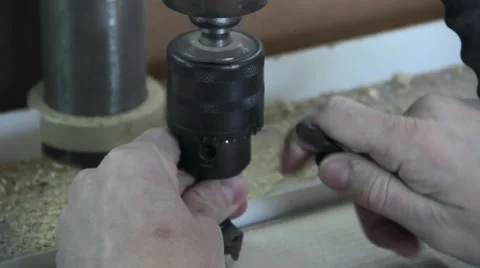 A man pinches drill in the machine Stock-Footage 63208526