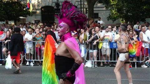 Man in Pink Dancing with Rainbow Flag at Madrid Pride Parade (MADO) Stock Footage 339205208