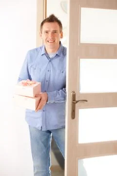 Man with pink gift Stock Photos