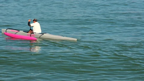 Man in a pink Kayak Stock Footage 152424597