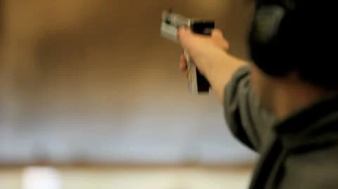 Man with a pistol Stock Footage 8951810