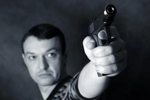 Man with a pistol Stock Photos