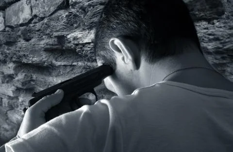 Man with a pistol Stock Photos