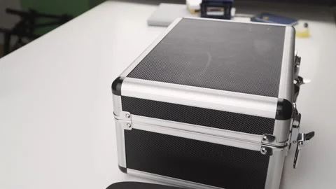  man place drone DJI MAVIC AIR with all accessories into protective case Stock Footage 138044357