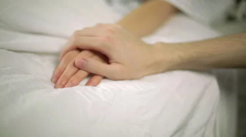 Man Places a Reassuring Hand on Female Hospital Patient Stock-Footage 50496953