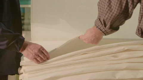 Man placing and touching new fabric Stock Footage 143771986