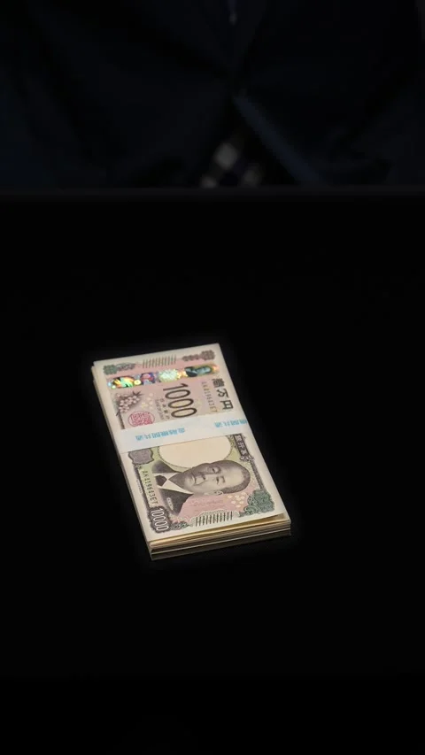 Man placing a bundle of cash in a dark deal Stock Footage 336766036