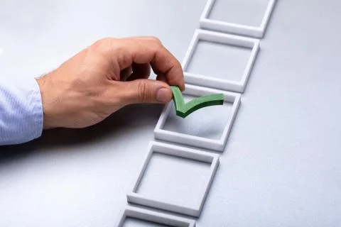 Man Placing Check Mark In Box Stock Photos