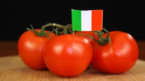 Man placing decorative toothpick with flag of Ireland into bunch of tomatoes. Stock Footage 152795160
