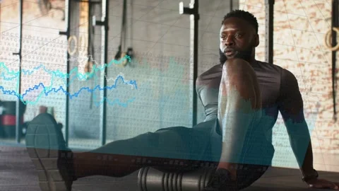 Man placing foam roller under right quad, rolling quad for fitness, data charts Stock Footage 334203889