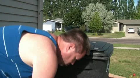 Man Placing Garbage into Can Видео 12598045