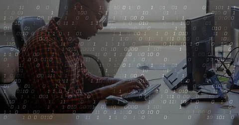 Man placing hands on keyboard, coding and leaning forward at tech desk, binary 스톡 사진
