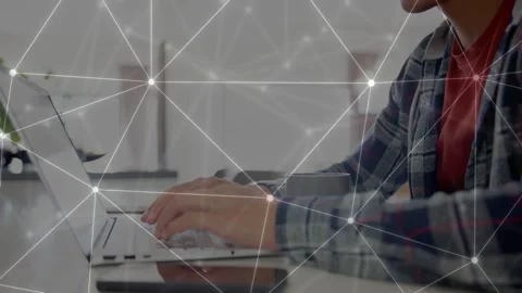 Man placing hands on keys, typing on laptop for tech while network nodes pulsing Stock Footage 333078075