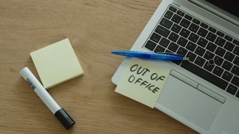 Man Placing Out of Office Note on Laptop Stock Footage 342344755