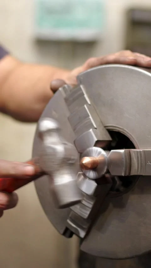 Man placing a piece of a machine using a hammer 스톡 동영상 260577070