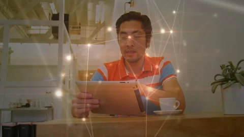 Man placing tablet on table in cafe, browsing data and causing network nodes Stock Footage 312116615