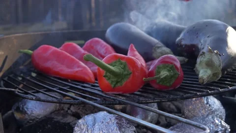 Man placing Vegetables, Eggplant &amp; Red Pepper on Grill 2 Stock Footage 150132190