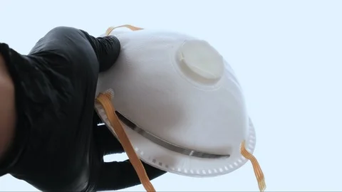 Man with plastic glove and protective virus mask ffp2,coronavirus covid disease Stock Footage 127385375