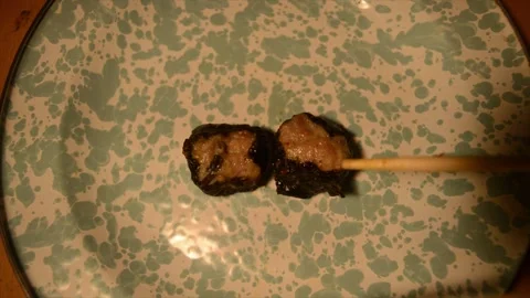 A man plating a Dim Sum carefully using chopstick stock footage Stock Footage 256213077