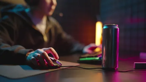 Man play computer late night with energy drink close up. Mouse and keyboard. Video stock 328220691