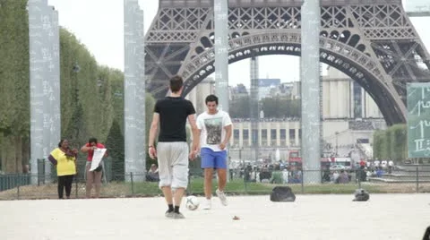 Man play football in Paris Stock Footage