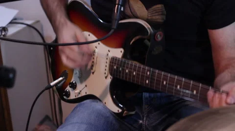 Man play guitars Stock Footage 45992939