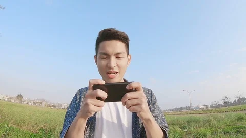 Man play mobile game Stock Footage 90017850