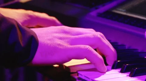 Man play music keyboard, colorful light Video stock 7746341