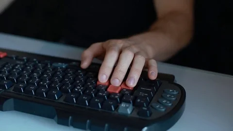 Man play video game using keyboard Stock Footage 72977675