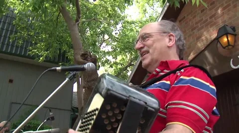 Man playing accordian side view Stock Footage 54630486