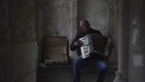 Man playing accordion alone Stock Footage 197328087