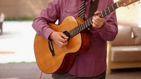 Man playing acoustic guitar Stock Footage 50449380