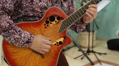 Man playing acoustic guitar Stock Footage 52717309