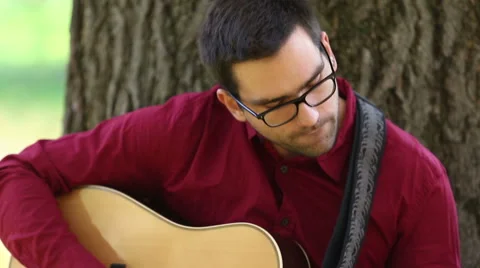 Man playing acoustic guitar Stock Footage 59556526