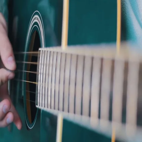Man Playing Acoustic Guitar. Slow Motion Stock Footage