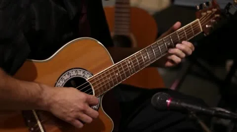 Man Playing Acustic Guitar into Microphone MS Stock Footage 11884463