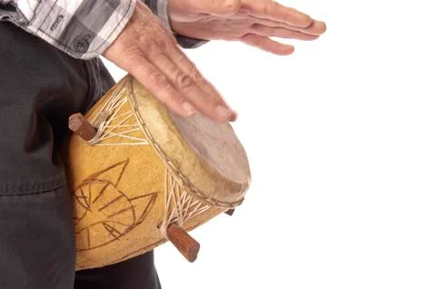 Man playing african drum between legs Stock Photos
