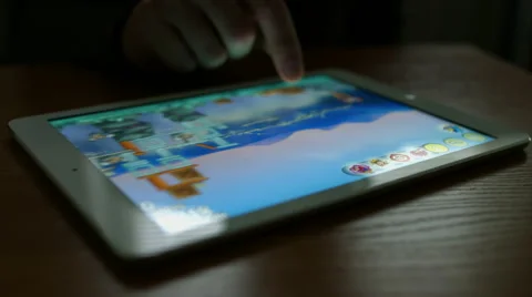 Man playing angry birds on a Tablet PC Video stock 47759995