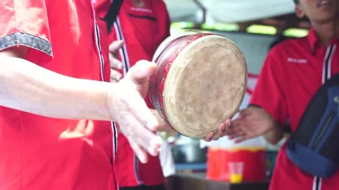 A man playing asian percussion kompang. Traditional Music Instrument Stock Footage 132229339