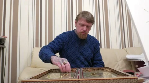 Man playing backgammon 動画素材 59856768