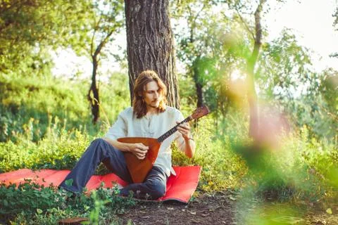 Man playing the balalaika Stock Photos