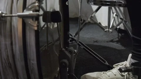 Man playing base drum pedal on stage. Close-up, Drummer playing drums set beater Stock Footage 317491552