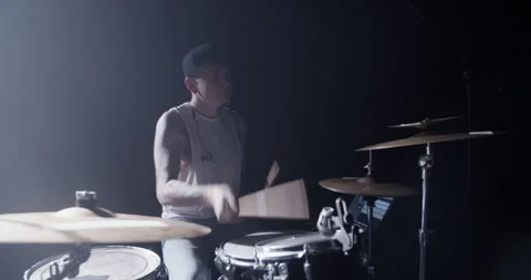 Man playing beat on drum set on stage Stock Footage 249852512