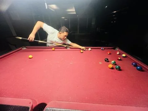 Man playing billiard on a pool table Stock Photos